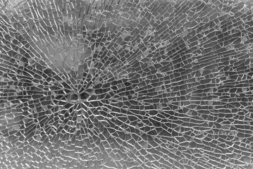 Close-up view of a damaged window, Broken cracked glass, glass cracks and splinters, accident...