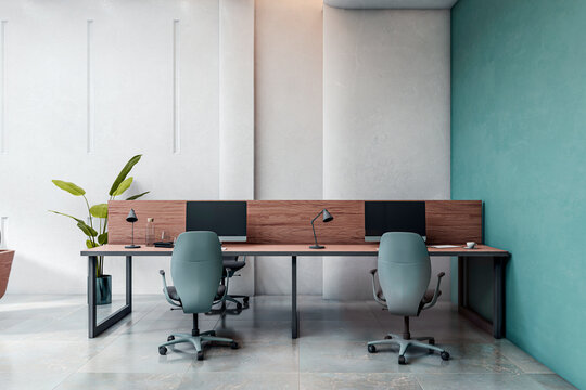 Modern coworking office interior with sleek desks, PCs and chairs in contemporary workspace setting with teal wall and clean minimalist design. 3D Rendering