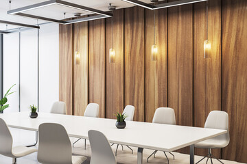Modern empty conference room with white chairs, wooden wall panels, pendant lighting and minimalist...