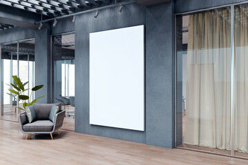 Vertical blank canvas mockup on dark wall inside modern corporate office hallway with glass...