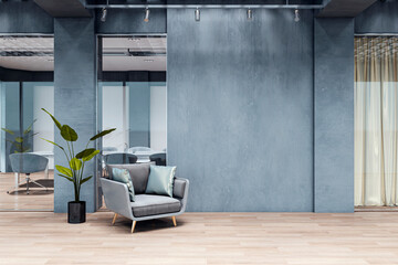 Modern corporate office hallway with empty blue wall, armchair, and wooden floor under spotlights...