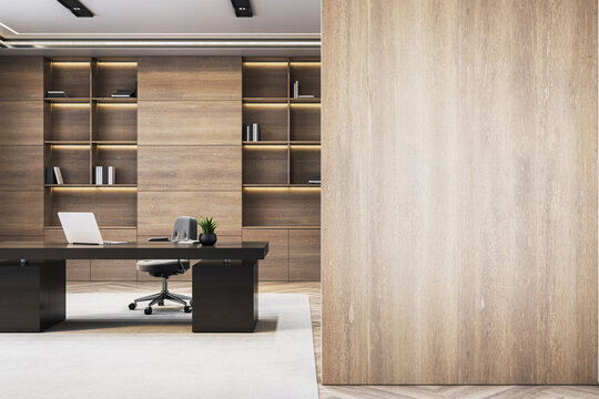 Modern luxury office interior with executive desk, wooden bookshelves and blank wooden wall for logo or poster mockup template background. 3D Rendering