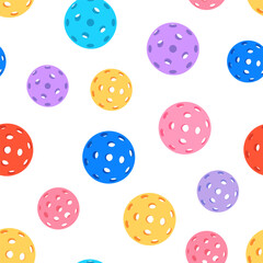 Seamless pattern of colorful pickleballs with perforated surfaces on a light beige background in a playful and modern flat design style