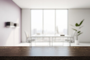Wooden tabletop in modern office interior with daylight and blurred background, ideal for product...