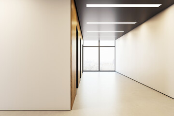 Modern empty corporate hallway with large window and city view in contemporary office building...