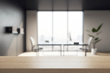 Wooden tabletop closeup in modern office with blurred background of contemporary meeting room...