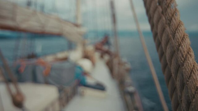 Sailing boat moves in the sea and arrives to the tropical island. Area of the town of Paraty, Brazil. Naturally blurred footage of the sailing vessel