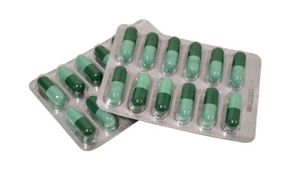 Medicine on white background, Close-up, Top view, Side view, Pile of supplements, Sachet, Green pills pack, Center composition