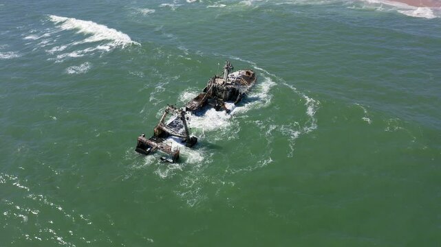 Slow panning drone shot of the Zeila Shipwreck stranded off Namibia&rsquo;s Skeleton Coast