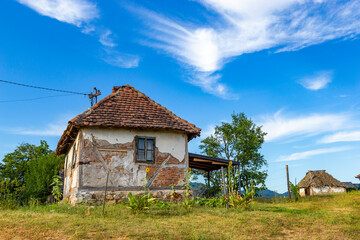 Old rural house in Serbia. Traditional Balkan countryside architecture.
