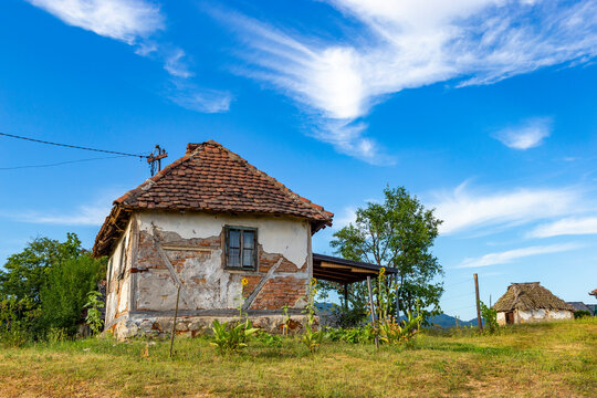 Old rural house in Serbia. Traditional Balkan countryside architecture. - Powered by Adobe