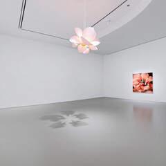 Minimalist Art Gallery Interior Featuring a Large Flower-Shaped Ceiling Light and a Single Flower Painting on the Wall