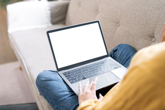 Woman hand using laptop, mockup image blank screen computer with blank white background
