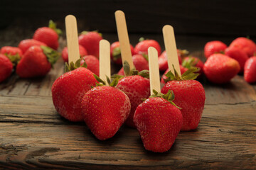 Beautiful, fresh, ripe strawberries on a wooden table. Concept, strawberries as a symbol of love...