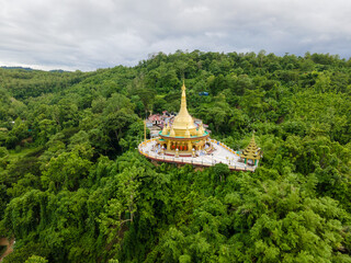 Buddhist Architecture Surrounded by Lush Green Hills. Aerial View of Golden Temple in Bandarban, Bangladesh