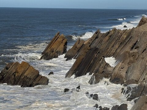 Cliffs Penedo da Saudade behind the lighthouse, in Marinha Grande, Sao Pedro de Moel area in Portugal, Europe