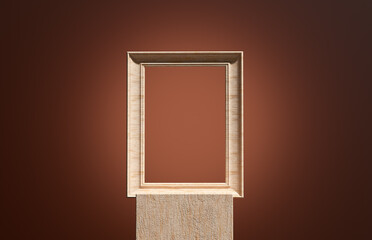 Empty wooden frame standing on a pedestal displaying nothing against brown background