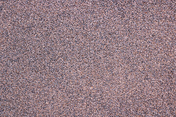 A detailed close up view of a carpet that has many small dots on it