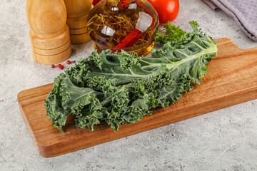 Green Kale cabbage leaves ocer board