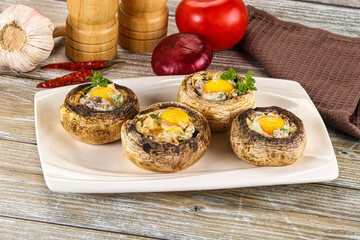 Baked champignon with quail egg