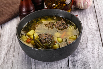 Soup with beef meatballs and vegetables