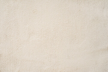 Beige plastered wall texture background. Plain light beige wall with soft plaster texture, minimal surface relief. Concept of simplicity, neutrality, architectural natural background
