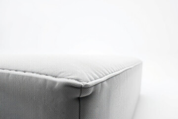 Close-up modern minimal sofa. Clean lines, simple design. Interior, furniture detail.