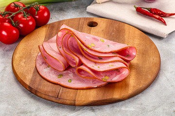 Mortadella pork sausages slices heap