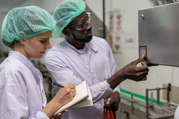 quality supervisor or food or pharmaceutical technician discuss about process control of food and...