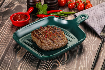 Grilled beef burger cutlet with sauce