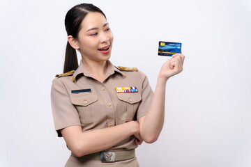 Young Thai Asian Teacher in the uniform is holding the credit card and look at the camera