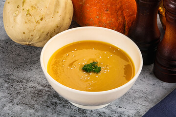 Vegan pumpkin cream soup served sesam