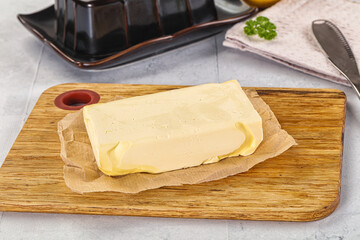 Dairy butter piece over board