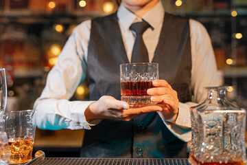  Professional female bartender preparing alcoholic drinks in a bar