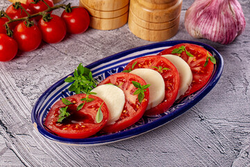 Italian caprese salad with mozzarella, tomato and basil