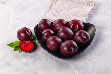 Raw ripe purple plum heap