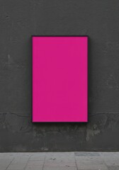 Photo of a vibrant magenta poster is displayed against a textured gray wall