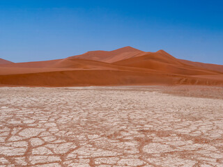 Fantastic Sossusvlei landscape in the Namib-Naukluft Park in Namibia. The salt-clay soil in the...