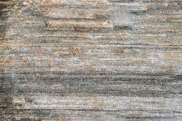 Natural stone surface displays a blend of earthy tones with textured patterns formed by time and...