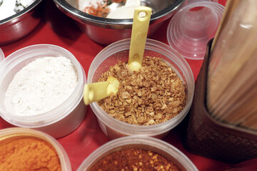 Garlic sprinkles in a jar, perfect for adding a savory kick to fried snacks.