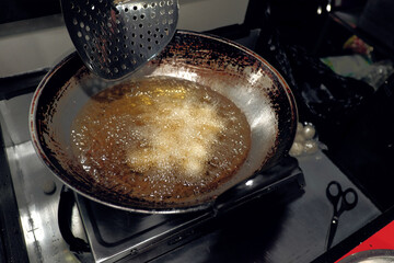 Round cimol, a traditional Sundanese snack, being cooked and  will be seasoned for a modern twist!...