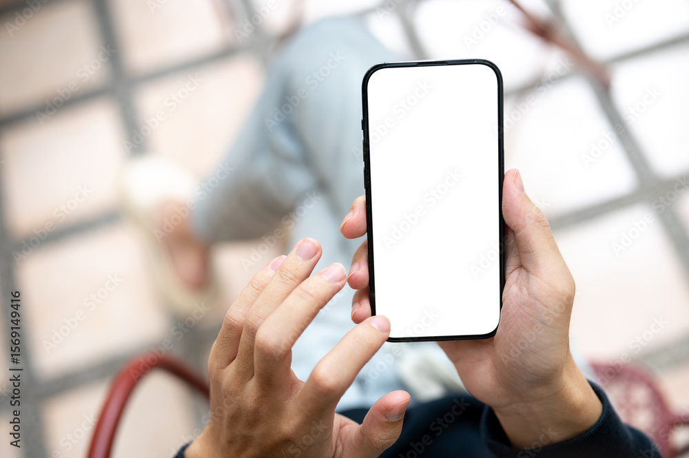 Poster close up of hand holding touching blank screen smartphone using application or social media on bench