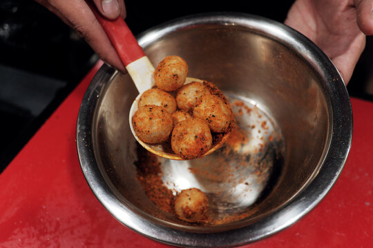 Round cimol, a traditional Sundanese snack, being cooked and  will be seasoned for a modern twist! A delicious street food favorite.