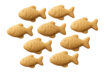 Miniature fish-shaped dog training treats, suitable for dogs with poultry allergies, used in a private garden.