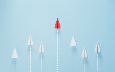 Red paper plane flying away from a group of white planes on blue background. Concept of leadership, innovation, individuality, thinking different, and unique direction.