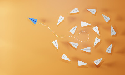 Red paper plane flying away from a group of white planes on orange background. Concept of leadership, innovation, individuality, thinking different, and unique direction.