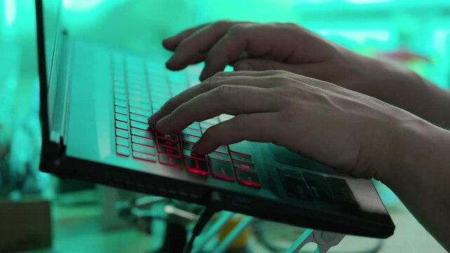 Man Writing Code On Laptop