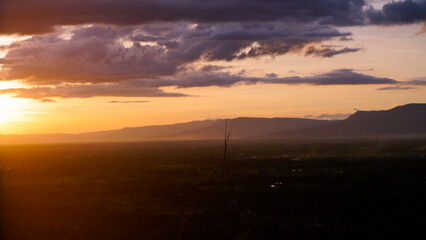 Golden sunset sky clouds in the evening sunrise.