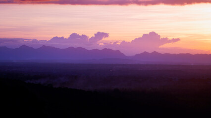 Golden sunset sky clouds in the evening sunrise.
