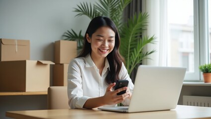 cheerful woman running an online business from home, using her phone and laptop